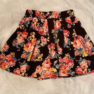 Ambiance Apparel skirt, M. Black background with pink, yellow, jade floral print
